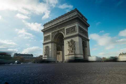 The Arc de Triomphe in Paris with blurred traffic in the foreground Stock Photos