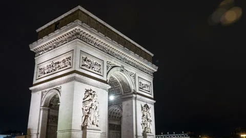 Arc de Triomphe  in Paris at cool night from a timelapse perspective Stock Footage 99328311