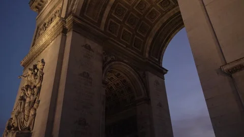 Arc de Triomphe in Paris with the emblem of the Paralympic Games at sunset in Stock Footage 282210054