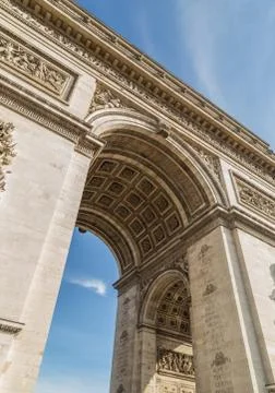 Arc de Triomphe in Paris under sky with clouds Stock Photos