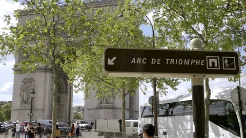 Arc de Triomphe sign close up at landmark monument with people walking - Paris Stock Footage 93811083