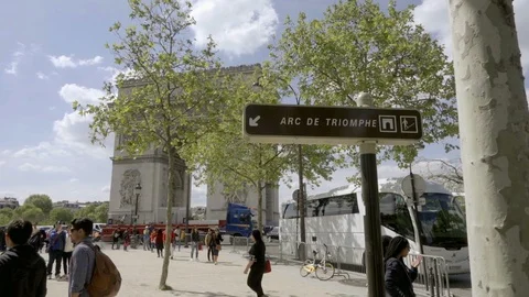 Arc de Triomphe sign front of monument with people tourists walking Paris France Stock Footage 93811065