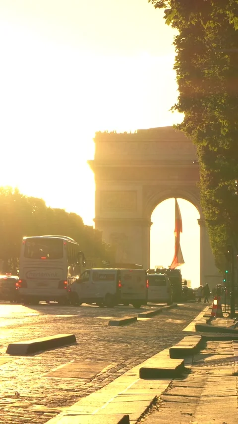 Arc de Triomphe Traffic and Pedestrians at Sunset in Paris City Street Scene Stock Footage 334943544