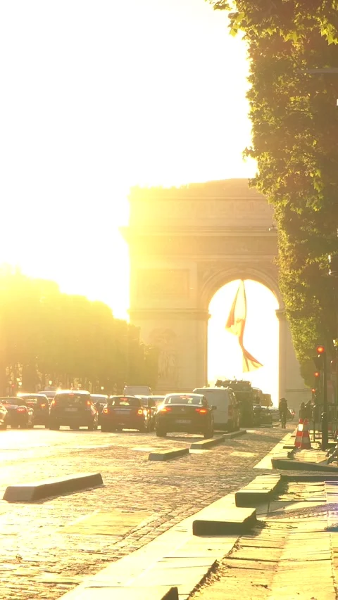 Arc de Triomphe with Traffic and Pedestrians in Bright Late Afternoon Sunlight Stock Footage 334954948