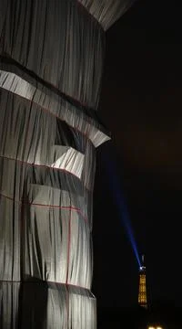 The Arc de Triomphe Wrapped and Eiffel Tower Stock Photos