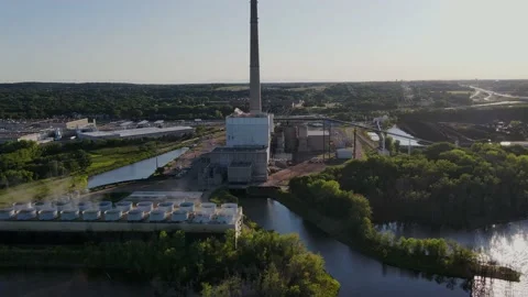 Arc Shot around the Allen King power plant in Stillwater, MN near sunset. Stock Footage