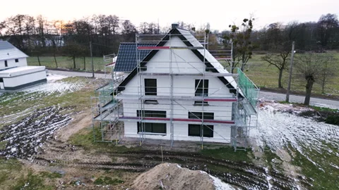 Arc shot of a construction site of a single-family house in Germany Stock Footage 233899868
