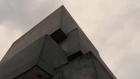 Arc shot of a corner of a brutalist style building. Stock Footage 111560113