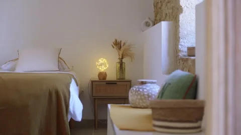 Arc Shot of Cozy Boho Bedroom with Warm Fairy Light Lamp, France Stock Footage 337231280