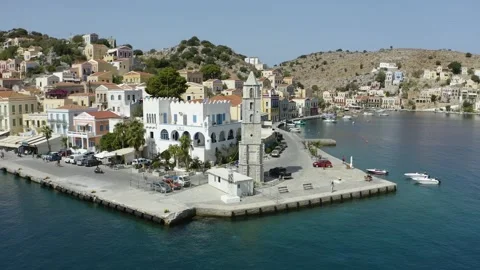 Arc Shot Small Old Town Сhapel In Afternoon, Seafront, Greece Aerial Drone Stock Footage 141133410