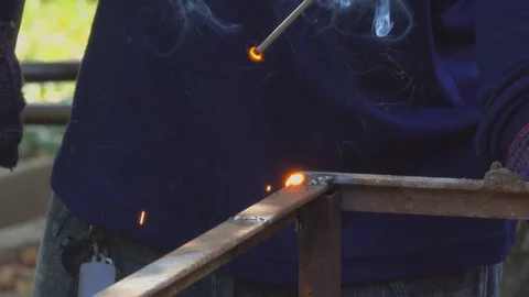 Arc welding iron steel structure on site building construction on bright light Stock Footage 99691246