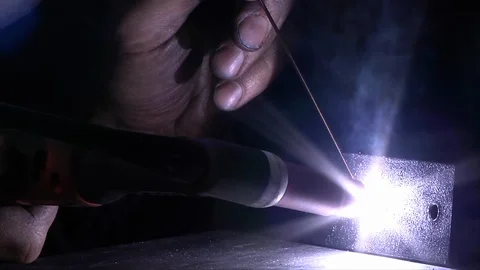Arc welding Sparks in the dark Stock Footage 105598038
