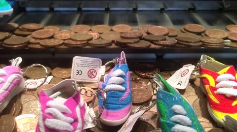 Arcade / Amusement Coin Pusher Machine - Bronze Coins 1080p with Prizes Video stock 43236424