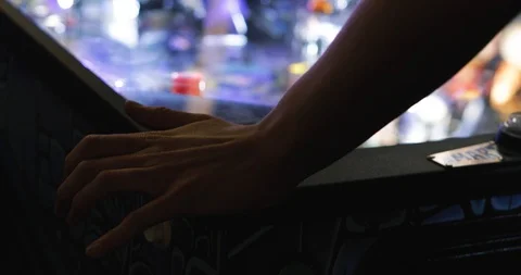 Arcade: Anonymous Man Using Flipper Button On Pinball Machine Stock Footage 107944496