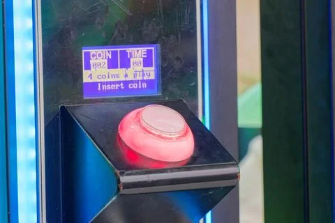 Arcade game machine illuminated button with coin insert instructions Stock Photos