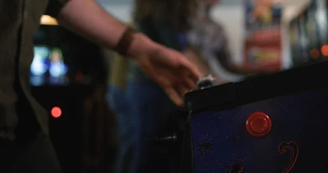 Arcade: Man Hitting Flipper Button On Pinball Stock Footage 107945647