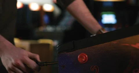 Arcade: Man Hitting Flipper Button On Pinball Stock Footage 107945779
