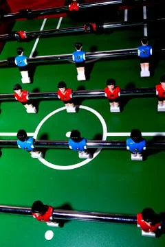 Arcade table soccer with tools for playing for office and home games. Stock Photos