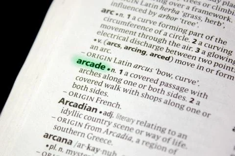 Arcade word or phrase in a dictionary. Stock Photos