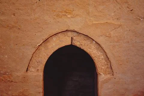 An arch in an ancient wall Stock Photos