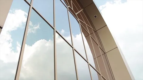 Arch arc windows on beige mall storefront with reflection of clouds moving Stock Footage 249755964