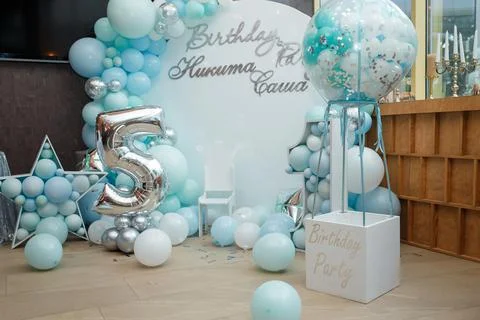 Arch of blue balloons for boy happy birthday party. Number 5 and 1 Stock Photos