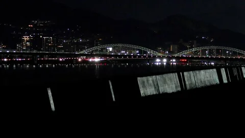 Arch Bridge and Silver Lit Breakwater Night View in Japan,4K Stock Footage 346022309