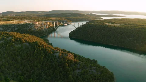Arch bridge over Krka river at sunset. Skradin, Croatia. Video stock 157147715