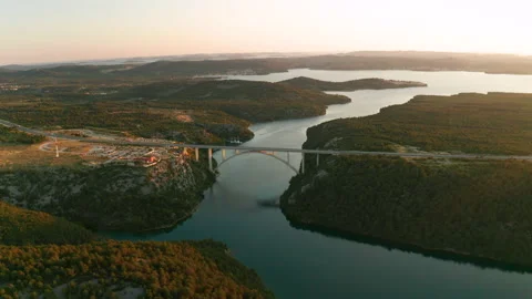 Arch bridge over Krka river at sunset. Skradin, Croatia. Stock Footage 157148582