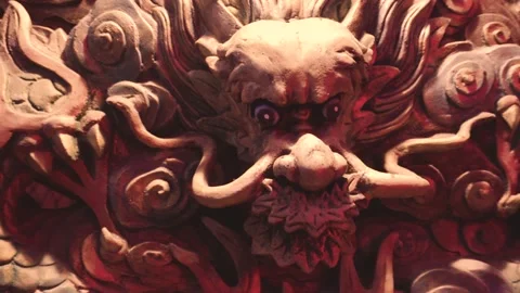 A arch camera take of a golden dragon carving on a red wall. Stock Footage 140231306