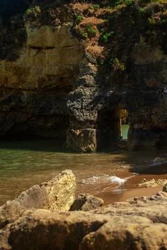 Arch in the cliff at the beach in Lagos, Portugal, 10.04.2021 - Vertical Stock Photos