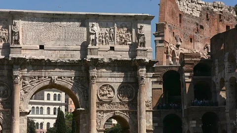 The Arch of Constantine and Colosseum ancient ruins in Rome, Italy Stock Footage 94994973