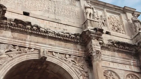 Arch of constantine rome italy next to colosseum pan right to left Stock Footage 252148104