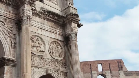 Arch of constantine rome italy next to colosseum pan left to right to colosseum Stock Footage 252148164