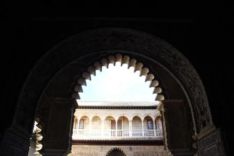 Arch of a courtyard in Seville of Arab Andalusian architecture Stock Photos