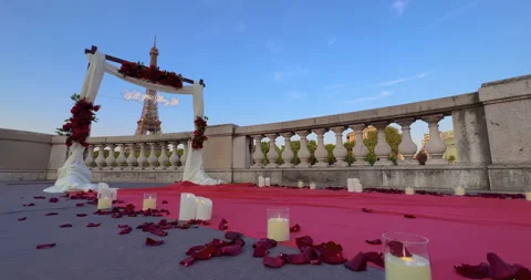 Arch with flowers in front of the Eiffel Tower in Paris. Establishing shot man Stock Footage 244639022
