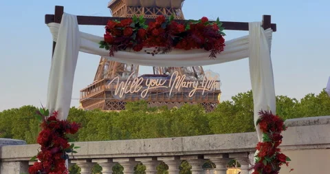 Arch with flowers in front of the Eiffel Tower in Paris. Establishing shot man Stock Footage 244639244