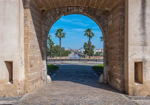 The Arch of Palm door and the deep path of the old Bridge Stock Photos