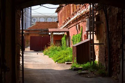 Arch. Passage to the inner courtyard. Texture. Light Stock Photos