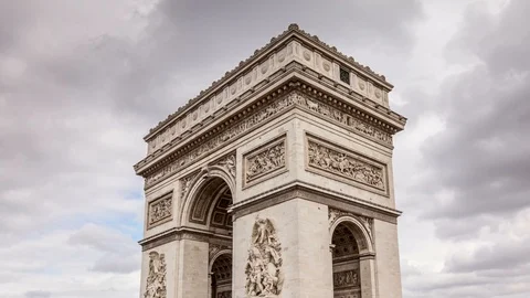 The Arch of Triumph (Arc de Triomphe) in Paris. Cloudy, dramatic sky. Tilt down. Stock Footage 87530674