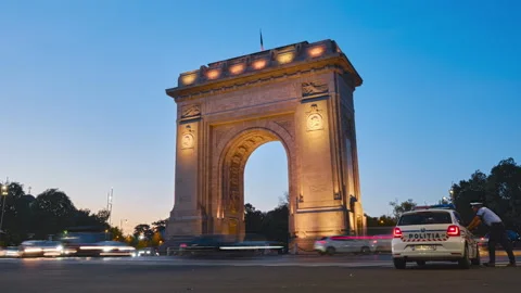 Arch of Triumph in Bucharest, Romania. Day to night hyperlapse in the evening. Stock Footage