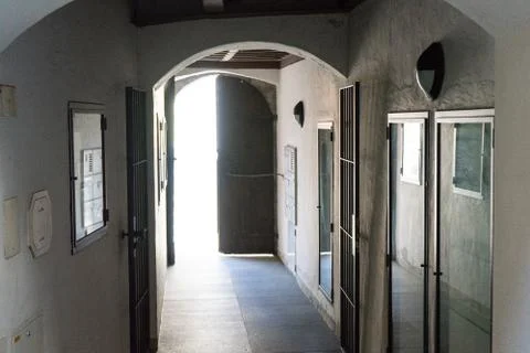 Arch view from inside house in to the light outside Stock Photos