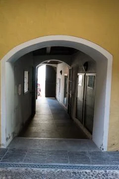 Arch view from inside house in to the light outside Stock Photos