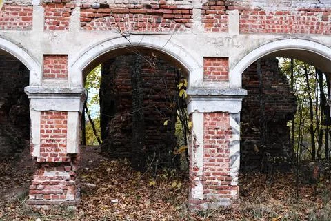 Arch wall retro architecture of the old ruined part of the building Stock Photos