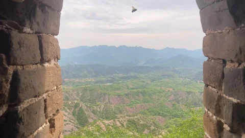 Arch window in old brick wall overlooking mountain landscape. Stock Footage 337651297