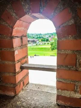 Arch window overlooking the courtyard Stock Photos