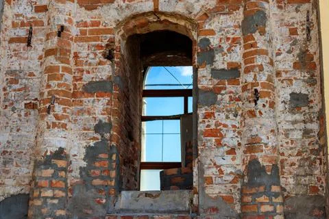 Arch window on the red brick wall in old building Fotos de archivo