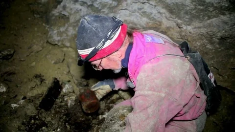 Archaeologist looking at a archaeological find Stock Footage 70114650