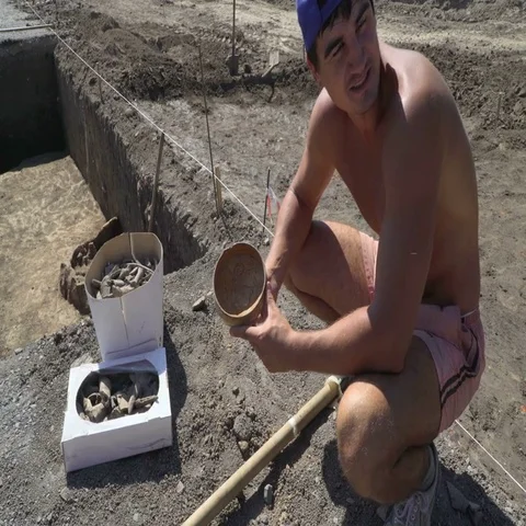 Archaeologist shows real found ancient bowl of Golden Horde period in Azov city Stock Footage 69380520