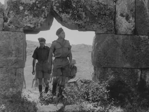 Archaeologists among Middle Eastern ruins Stock Footage 158024689